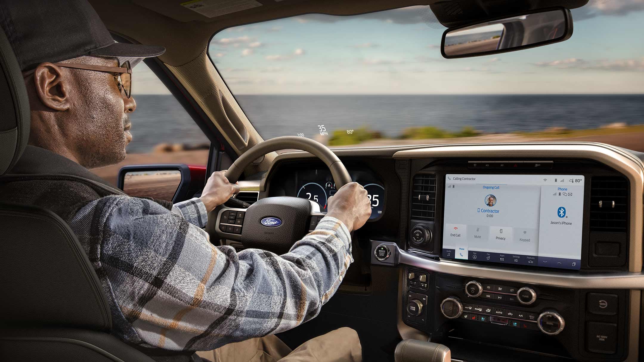 Man driving a 2025 Ford F-150® King Ranch® showing the center stack display screen